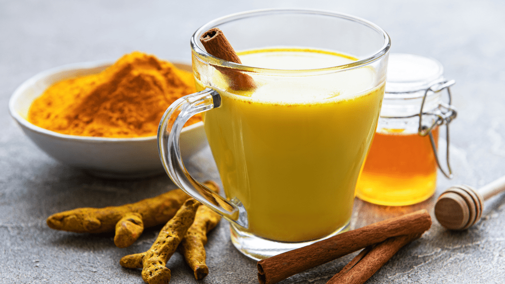 foods that help reduce period pain, including turmaric milk,Tea.