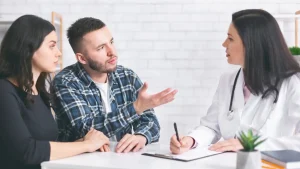 Borneo Hospital discusses stress and fertility with a couple in a supportive consultation.