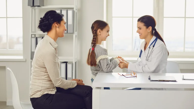 A mother and her teenage daughter are having a positive consultation about HPV Vaccination for preventive gynaecological care at a women's health clinic.