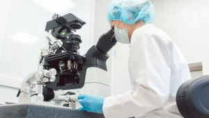 An expert embryologist performs IVF treatment in the advanced lab of a top IVF centre.